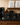 Stephen James single serve coffee pods in light, medium, and dark roast with 12-count boxes and 50-count bulk bags displayed beside a coffee brewer.