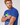 Close-up of the Message Tee Pelotonia Edition sleeve embroidery on a male model