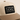 Angled product view of the Classic 5-Panel Hat — Heritage Patch in khaki with a black Stephen James Curated Coffee Collection front patch.