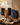Stephen James Rituales de Origen Complete Collection arranged on a linen tray with five premium coffee bags, a steaming ceramic cup of coffee, book, candle, and warm morning light.